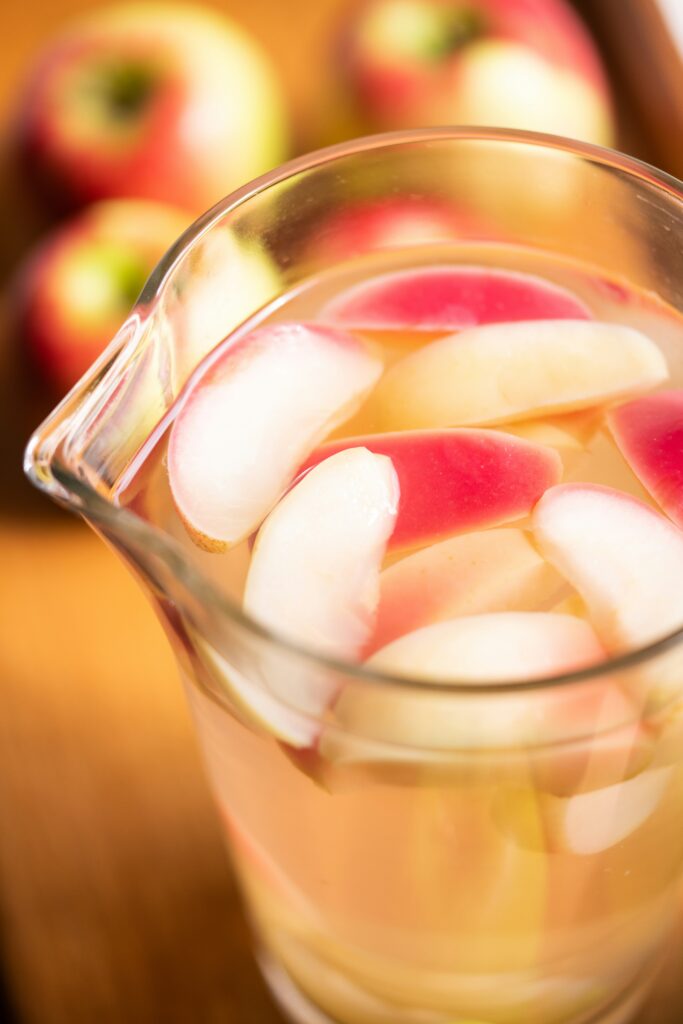 Apple pieces in the glass full of vinegar 